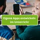 Mädchen mit Smartphone in der Hand, Text eigene Apps entwickeln im Unterricht
